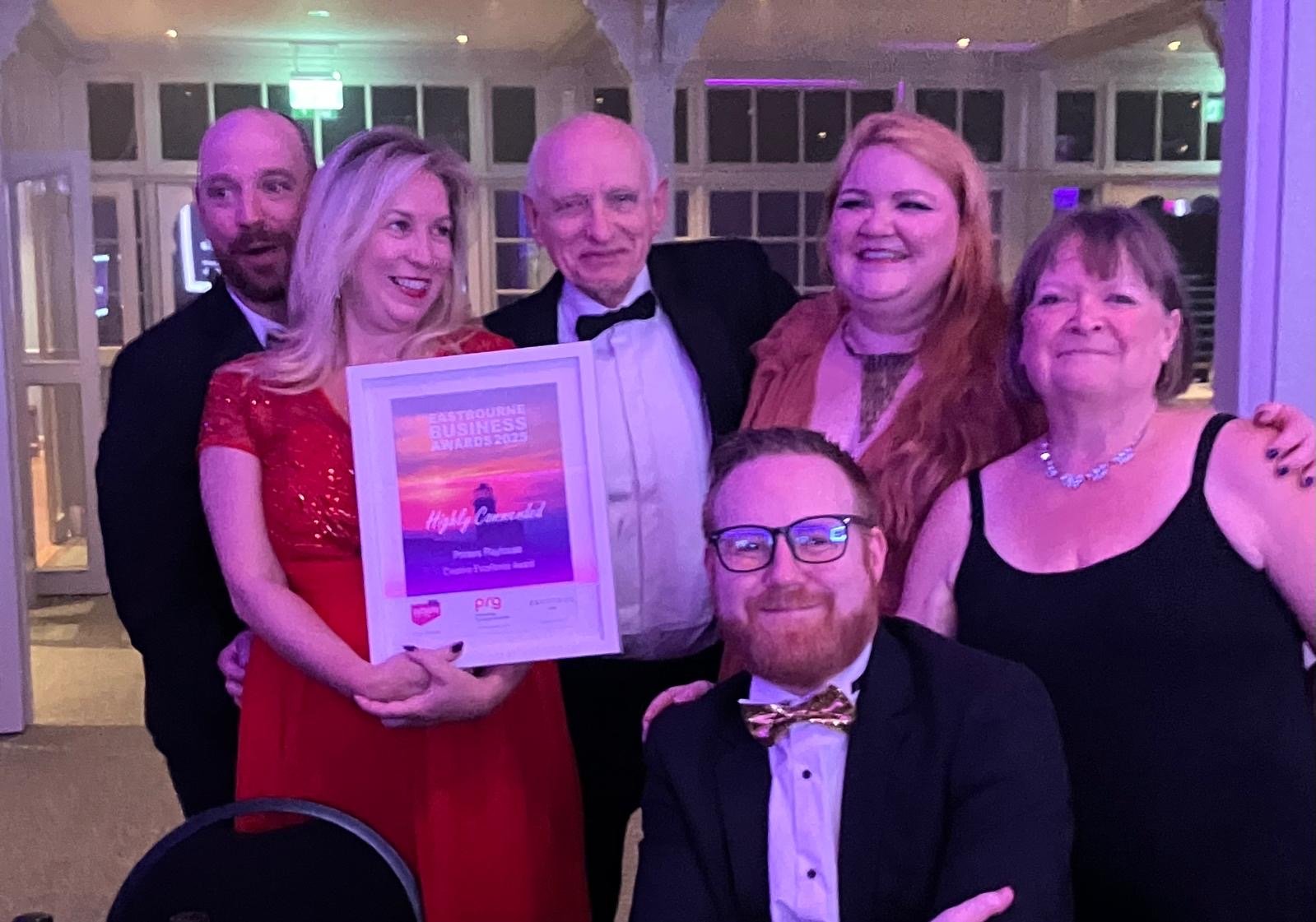 The Printers Playhouse team celebrating a community award