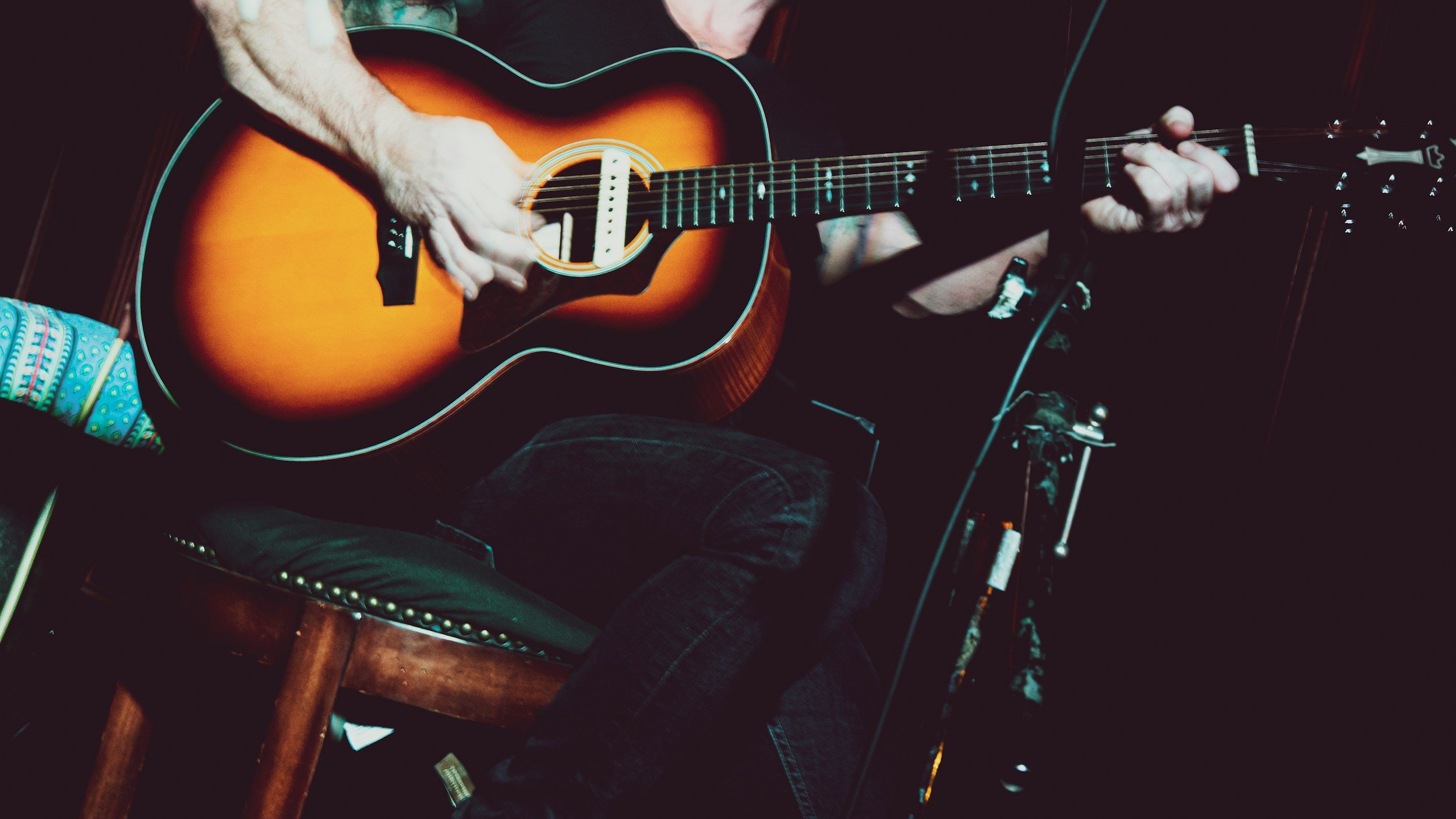 A guitarist playing live